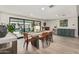 Elegant dining room with modern decor, a stylish bar, and sliding glass doors to the pool at 3016 N 49Th St, Phoenix, AZ 85018