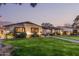 Charming home featuring a manicured lawn, elegant walkway, and inviting exterior lighting at 3016 N 49Th St, Phoenix, AZ 85018