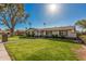 Well-manicured front yard with green lawn and a brick pathway to the home at 3016 N 49Th St, Phoenix, AZ 85018
