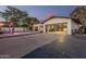 Large garage with a pool, patio, basketball hoop, and open garage doors at 3016 N 49Th St, Phoenix, AZ 85018