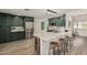 Stylish kitchen featuring stainless appliances, quartz counters, and bar stool seating at 3016 N 49Th St, Phoenix, AZ 85018