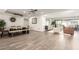Bright, open-concept living room with a dining table and seamless access to the outdoor pool area at 3016 N 49Th St, Phoenix, AZ 85018