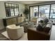 Bright living room with modern furniture, a large mirror, and sliding glass doors to the outdoor patio at 3016 N 49Th St, Phoenix, AZ 85018