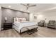 Inviting main bedroom with a decorative accent wall, a plush bed, accent seating, and ample natural light at 3016 N 49Th St, Phoenix, AZ 85018