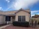 Well-maintained home entrance with security door and landscaped front yard at 3140 N 114Th Dr, Avondale, AZ 85392