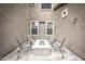 Outdoor patio area with a cozy fire pit and comfortable seating for relaxation at 35317 N 31St Dr, Phoenix, AZ 85086