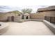 Backyard featuring an outdoor fireplace with integrated seating, perfect for gatherings at 35317 N 31St Dr, Phoenix, AZ 85086