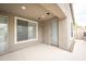 Covered patio with views to the adjacent property line and narrow side yard at 35317 N 31St Dr, Phoenix, AZ 85086