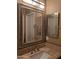 Bathroom featuring a single sink vanity with granite countertops and framed mirrors at 35317 N 31St Dr, Phoenix, AZ 85086