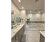 Bathroom featuring double sinks and a glass-enclosed shower with tile surround at 35317 N 31St Dr, Phoenix, AZ 85086