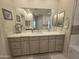 Bathroom features a spacious vanity, ample storage, a large mirror, and modern fixtures at 35317 N 31St Dr, Phoenix, AZ 85086