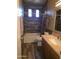 Bathroom featuring a combination tub shower and single sink vanity at 35317 N 31St Dr, Phoenix, AZ 85086