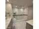 Bathroom featuring double sinks and a glass-enclosed shower with a seat at 35317 N 31St Dr, Phoenix, AZ 85086