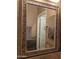 Close up of bathroom mirror with decorative tile frame above the granite countertop at 35317 N 31St Dr, Phoenix, AZ 85086