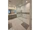 Bathroom featuring double sinks and a glass-enclosed shower with tile surround at 35317 N 31St Dr, Phoenix, AZ 85086