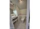 Bathroom featuring a floating vanity, modern fixtures, and stylish tilework at 35317 N 31St Dr, Phoenix, AZ 85086