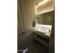 Bathroom featuring a floating vanity, stylish pendant lights, modern fixtures and unique tilework at 35317 N 31St Dr, Phoenix, AZ 85086