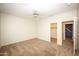 Neutral bedroom featuring plush carpet, ceiling fan, and door leading to another bedroom at 35317 N 31St Dr, Phoenix, AZ 85086