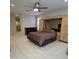 Bright bedroom featuring a ceiling fan, a built-in wardrobe, and tile flooring at 35317 N 31St Dr, Phoenix, AZ 85086