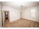 Bedroom featuring plush carpet and two doors leading to additional rooms at 35317 N 31St Dr, Phoenix, AZ 85086
