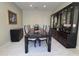 Formal dining room featuring a large table with seating for eight, elegant decor, and lots of display space at 35317 N 31St Dr, Phoenix, AZ 85086