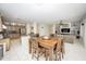 Open floorplan view of kitchen, dining room and living room area with modern tile floors at 35317 N 31St Dr, Phoenix, AZ 85086