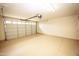 View of a clean and well-maintained garage with epoxy flooring and ample space at 35317 N 31St Dr, Phoenix, AZ 85086