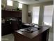 Spacious home office with built-in desk, natural light, and ample storage at 35317 N 31St Dr, Phoenix, AZ 85086