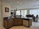 Bright, modern kitchen featuring granite countertops, stainless steel appliances, and views of the living spaces at 35317 N 31St Dr, Phoenix, AZ 85086