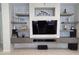 Stylish living room with custom entertainment center and modern decor at 35317 N 31St Dr, Phoenix, AZ 85086