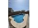Backyard view showcasing a refreshing private pool with surrounding patio space at 35317 N 31St Dr, Phoenix, AZ 85086
