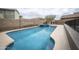 Backyard pool and spa with a stone waterfall feature, creating a tranquil oasis at 35317 N 31St Dr, Phoenix, AZ 85086