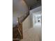 Staircase with decorative wrought iron railing, leading to the second floor landing and hallway at 35317 N 31St Dr, Phoenix, AZ 85086