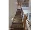 Carpeted staircase with decorative iron railing, leading to an upstairs landing area at 35317 N 31St Dr, Phoenix, AZ 85086