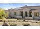 Elegant home featuring a desert landscape and an arched entryway at 37146 N Granite Creek Ln, Carefree, AZ 85377