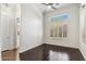 Bright bedroom featuring hardwood floors, a ceiling fan, and plantation shutters for optimal light control at 41624 N Anthem Ridge Dr, Anthem, AZ 85086