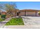 Charming home with a well-manicured lawn and stone accents, featuring a spacious two-car garage at 41624 N Anthem Ridge Dr, Anthem, AZ 85086