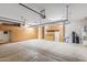 Spacious garage with ample cabinet storage and epoxy floors for all your projects and vehicles at 41624 N Anthem Ridge Dr, Anthem, AZ 85086