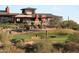 Golf course scenery with desert landscaping and golfer, highlighting community recreation at 41624 N Anthem Ridge Dr, Anthem, AZ 85086