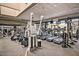 Bright fitness center with cardio machines, weight machines, and wall-mounted televisions at 41624 N Anthem Ridge Dr, Anthem, AZ 85086