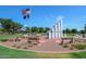 Veterans memorial monument with American flags and benches in the center of the community at 41624 N Anthem Ridge Dr, Anthem, AZ 85086