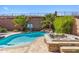 Inviting pool and spa with lush landscaping, creating a private backyard oasis at 41624 N Anthem Ridge Dr, Anthem, AZ 85086