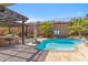 Resort-style pool area featuring a covered patio, BBQ area, and mature landscaping for ultimate relaxation at 41624 N Anthem Ridge Dr, Anthem, AZ 85086