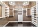 A spacious walk-in closet with custom shelving and a modern chandelier at 41624 N Anthem Ridge Dr, Anthem, AZ 85086