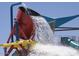 Fun water bucket feature in the community's splash park, perfect for Gathering entertainment at 41624 N Anthem Ridge Dr, Anthem, AZ 85086