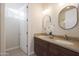 Bathroom featuring dual sinks, granite countertops, and a vanity with dark wood cabinets at 4241 N Pebble Creek Pkwy # 54, Goodyear, AZ 85395