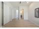 Bright bedroom boasts wood-look floors, double closets, bathroom access and neutral walls at 4241 N Pebble Creek Pkwy # 54, Goodyear, AZ 85395