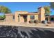 Charming single-story home with stone and stucco exterior, and manicured landscaping at 4241 N Pebble Creek Pkwy # 54, Goodyear, AZ 85395