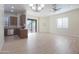 Bright, open-concept living space featuring hardwood floors and a sliding glass door to the patio at 4241 N Pebble Creek Pkwy # 54, Goodyear, AZ 85395