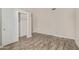 The bedroom has updated tile floors, neutral paint, and a closet space with a sliding door at 4536 E Beck Ln, Phoenix, AZ 85032